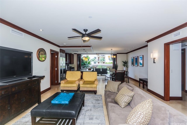 living room featuring baseboards, crown molding, visible vents, and ceiling fan with notable chandelier