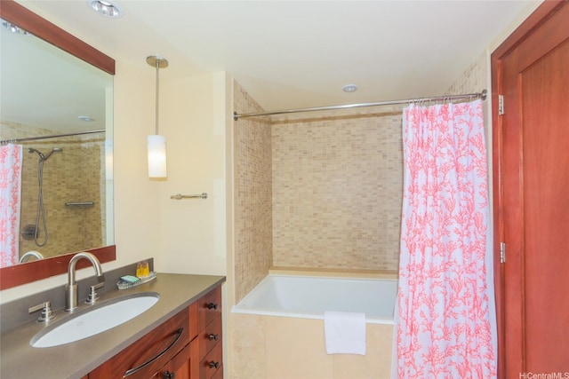 full bathroom with shower / tub combo with curtain and vanity