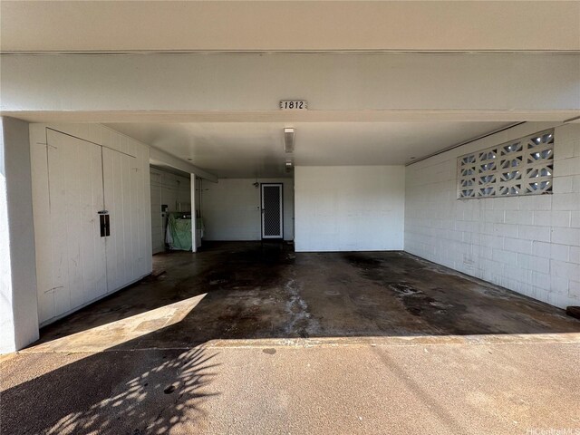 garage with concrete block wall