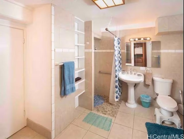 410 Nahua St Unit 212, Honolulu, HI 96815 - bathroom with a tile shower and tile patterned flooring