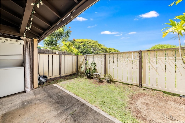 94-160 Anania Dr Unit 265, Mililani, HI 96789 - view of yard with a fenced backyard, stacked washing maching and dryer, and a patio