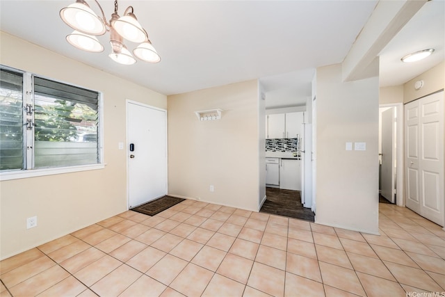 94-160 Anania Dr Unit 265, Mililani, HI 96789 - foyer entrance featuring a notable chandelier and light tile patterned floors
