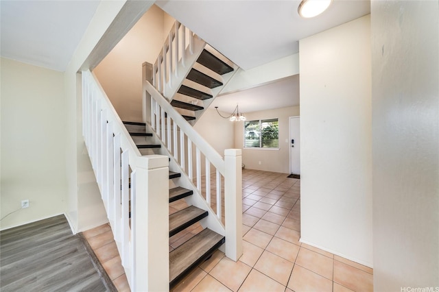 94-160 Anania Dr Unit 265, Mililani, HI 96789 - staircase featuring tile patterned floors and a notable chandelier