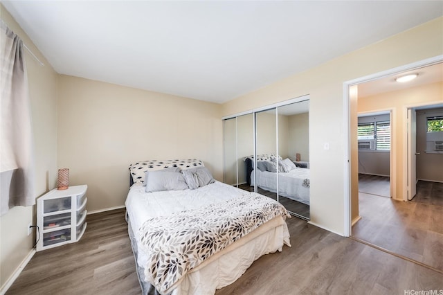 94-160 Anania Dr Unit 265, Mililani, HI 96789 - bedroom with baseboards, wood finished floors, and a closet