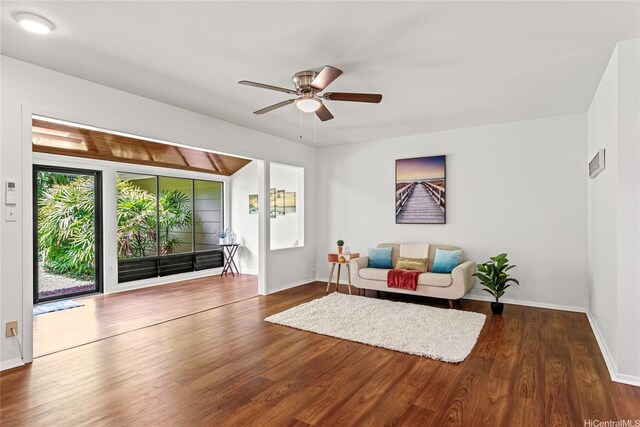 sitting room featuring wood finished floors, visible vents, a ceiling fan, and baseboards
