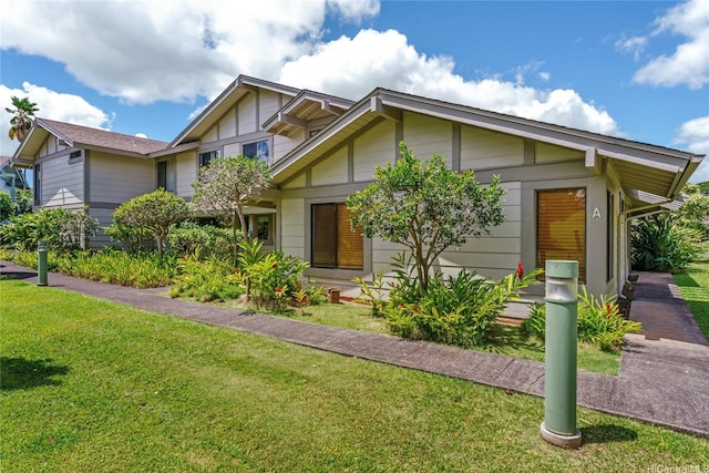 craftsman-style home with a front lawn and a garage