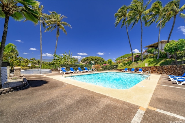 pool featuring a patio area and a community hot tub