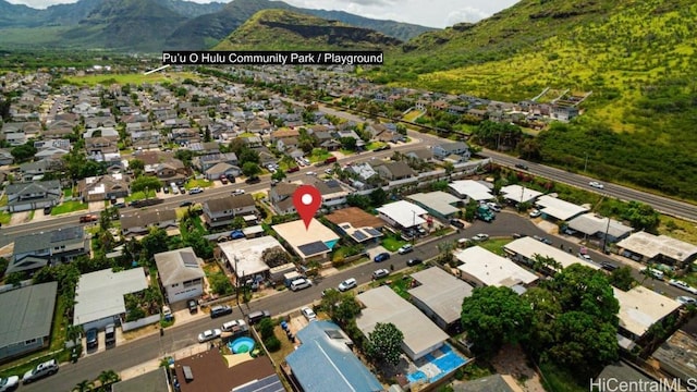 birds eye view of property with a mountain view and a residential view