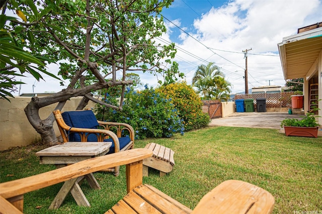 view of yard with fence and a patio