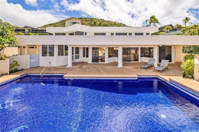 31 Poipu Dr, Honolulu, HI 96825 - exterior space featuring an outdoor pool, a patio area, and stucco siding