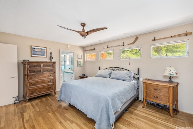 31 Poipu Dr, Honolulu, HI 96825 - bedroom featuring light wood-type flooring, ceiling fan, and connected bathroom