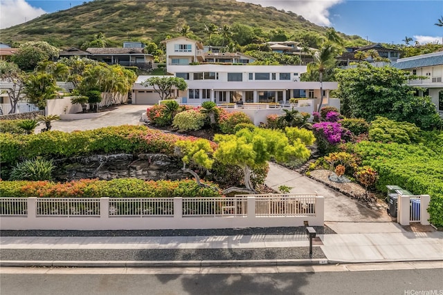 31 Poipu Dr, Honolulu, HI 96825 - exterior space with a mountain view, a garage, and a fenced front yard