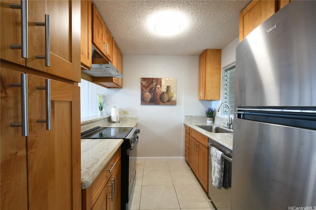 98-719 Iho Pl Unit 5/804, Aiea, HI 96701 - kitchen with stainless steel appliances, under cabinet range hood, brown cabinets, a textured ceiling, and light stone countertops