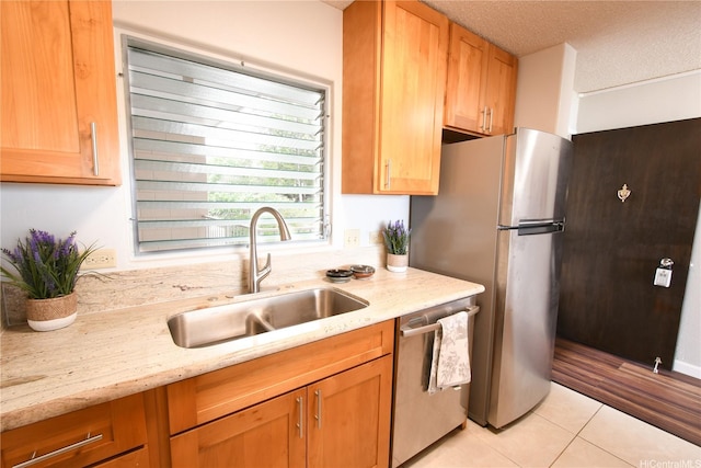 98-719 Iho Pl Unit 5/804, Aiea, HI 96701 - kitchen with appliances with stainless steel finishes, light tile patterned floors, a textured ceiling, and light stone counters