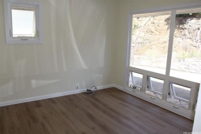 155 Polihale Pl, Honolulu, HI 96825 - spare room featuring dark wood-style flooring, healthy amount of natural light, and baseboards