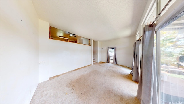 92-1244 Kikaha St Unit 14, Kapolei, HI 96707 - carpeted spare room with a textured ceiling and ceiling fan