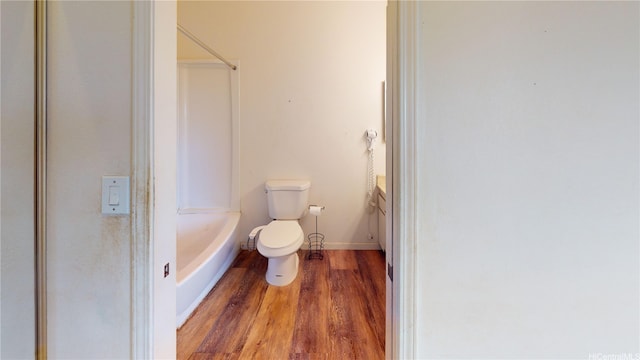 92-1244 Kikaha St Unit 14, Kapolei, HI 96707 - bathroom featuring wood finished floors, toilet, vanity, baseboards, and bathtub / shower combination