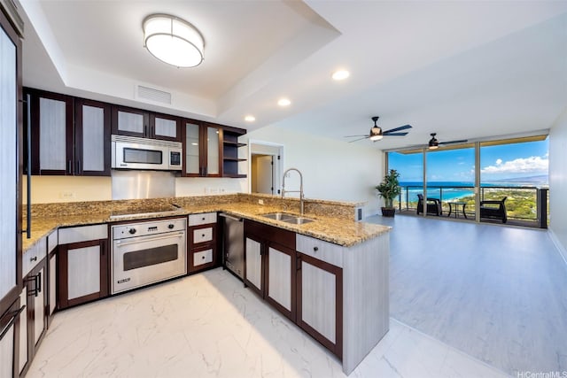 1551 Ala Wai Blvd Unit 2903, Honolulu, HI 96815 - kitchen with stainless steel appliances, a peninsula, a sink, visible vents, and expansive windows