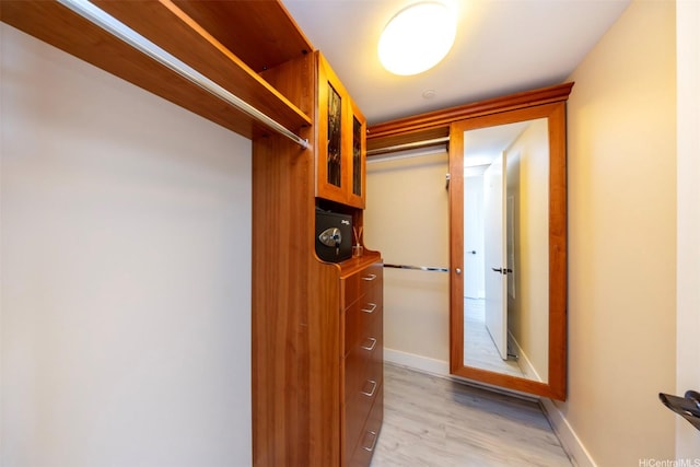 1551 Ala Wai Blvd Unit 2903, Honolulu, HI 96815 - walk in closet featuring light wood finished floors