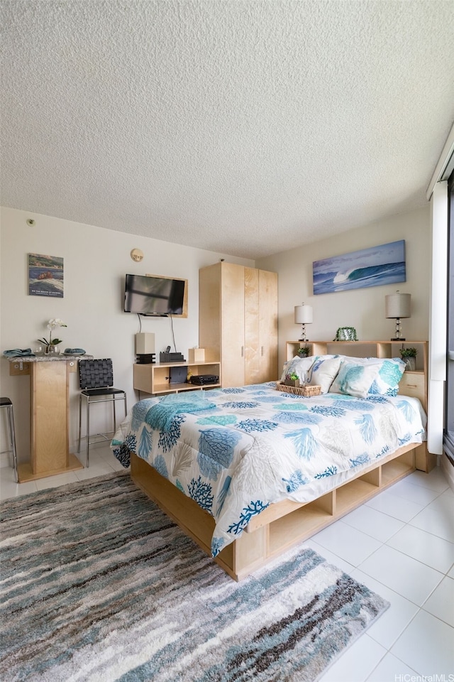 134 Kapahulu Ave Unit 617, Honolulu, HI 96815 - tiled bedroom with a textured ceiling