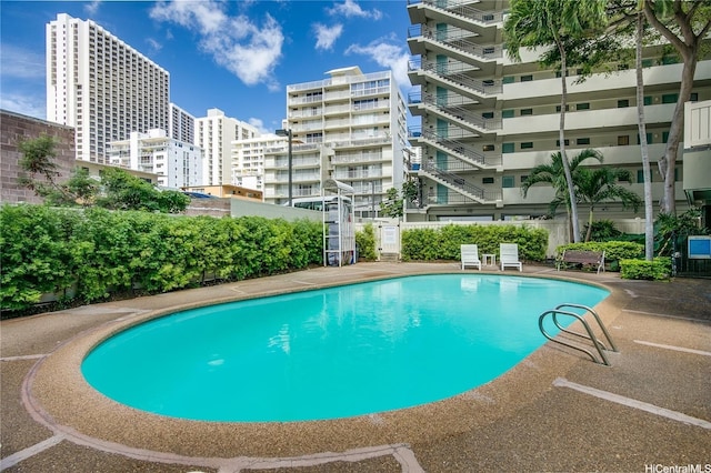 134 Kapahulu Ave Unit 617, Honolulu, HI 96815 - community pool with a city view and fence