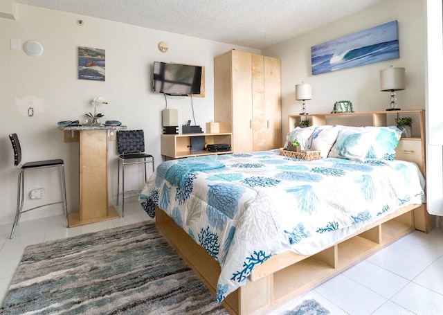 134 Kapahulu Ave Unit 617, Honolulu, HI 96815 - bedroom with tile patterned floors and a textured ceiling
