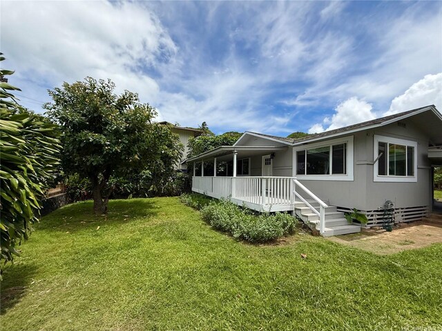 47-104 Hunaahi St, Kaneohe, HI 96744 - rear view of house featuring covered porch and a lawn