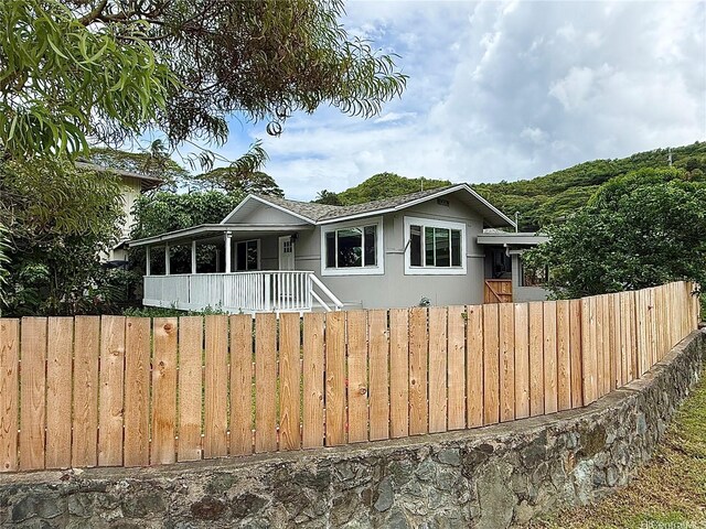 47-104 Hunaahi St, Kaneohe, HI 96744 - view of front facade with a porch and stucco siding