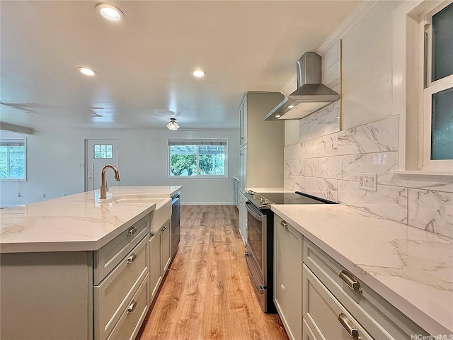 47-104 Hunaahi St, Kaneohe, HI 96744 - kitchen with wall chimney range hood, appliances with stainless steel finishes, gray cabinetry, light wood-style floors, and recessed lighting