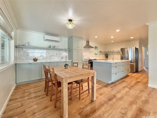 47-104 Hunaahi St, Kaneohe, HI 96744 - dining space with a wall unit AC, ornamental molding, recessed lighting, and light wood-style floors