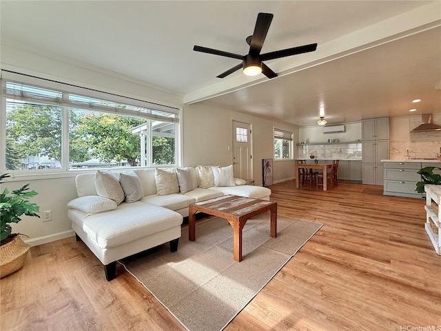47-104 Hunaahi St, Kaneohe, HI 96744 - living area featuring light wood-style floors and a ceiling fan