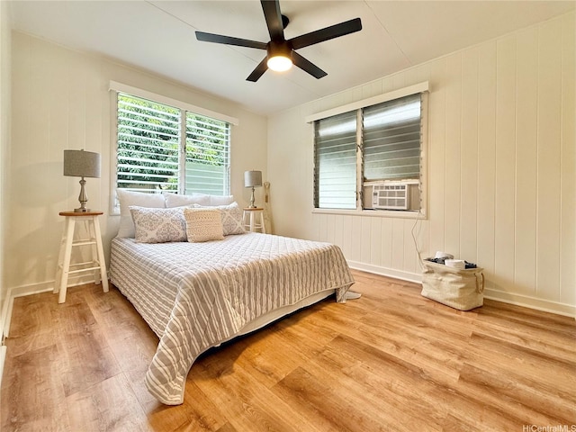 47-104 Hunaahi St, Kaneohe, HI 96744 - bedroom with wood finished floors, cooling unit, and a ceiling fan