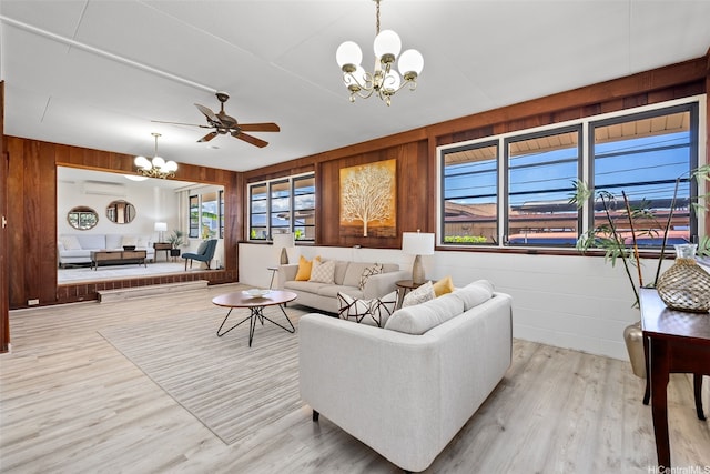 1230 Hoohulu St, Pearl City, HI 96782 - living room with a chandelier, wood walls, light wood-type flooring, a ceiling fan, and a wall unit AC