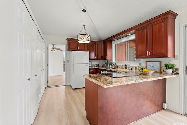 94-441 Kauopua St, Mililani, HI 96789 - kitchen with freestanding refrigerator, black electric stovetop, light wood-style floors, a peninsula, and light stone counters