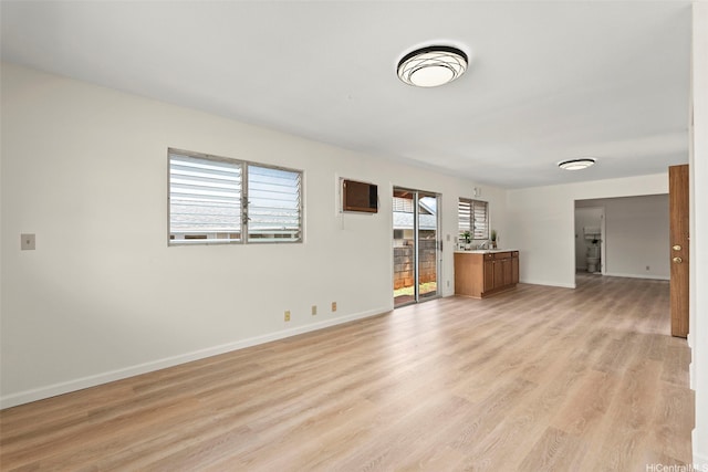 94-441 Kauopua St, Mililani, HI 96789 - unfurnished living room featuring baseboards and light wood finished floors