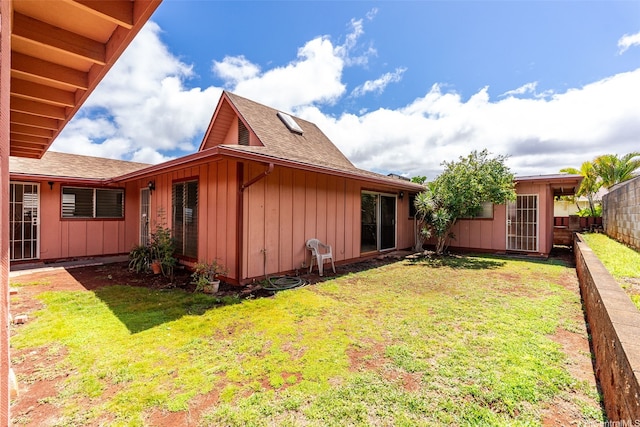94-441 Kauopua St, Mililani, HI 96789 - view of side of home featuring board and batten siding and roof with shingles