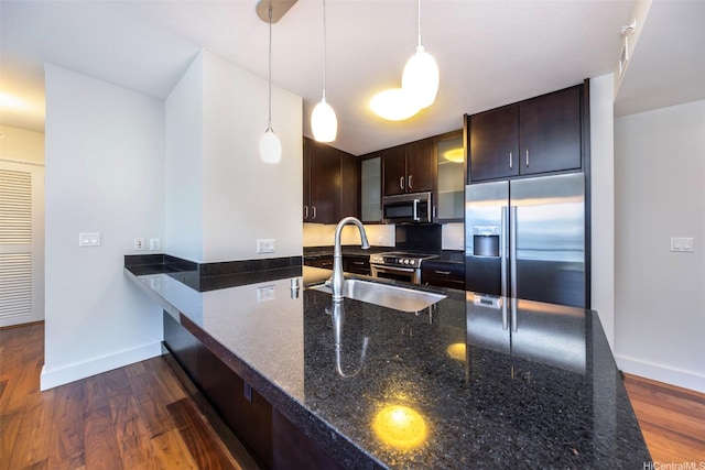 1189 Waimanu St Unit 2803, Honolulu, HI 96814 - kitchen featuring appliances with stainless steel finishes, baseboards, dark brown cabinets, and dark wood-style floors