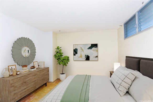 46-255 Kahuhipa St Unit 1001, Kaneohe, HI 96744 - bedroom with light wood-style flooring
