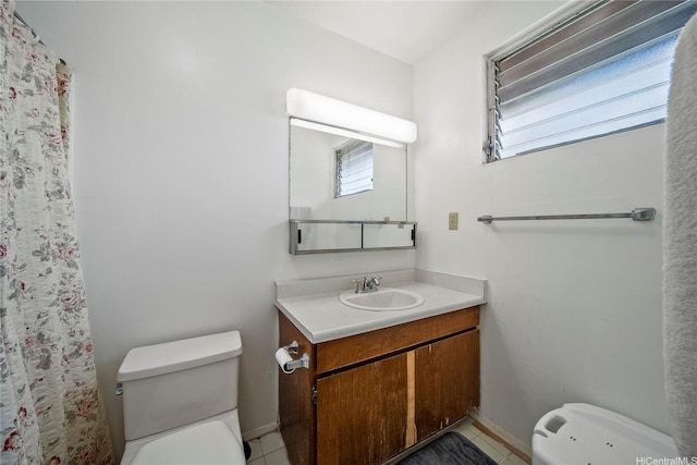 full bath featuring vanity, curtained shower, toilet, baseboards, and tile patterned floors