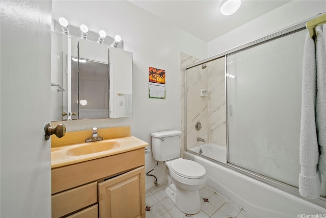 full bath with vanity, tile patterned flooring, combined bath / shower with glass door, and toilet