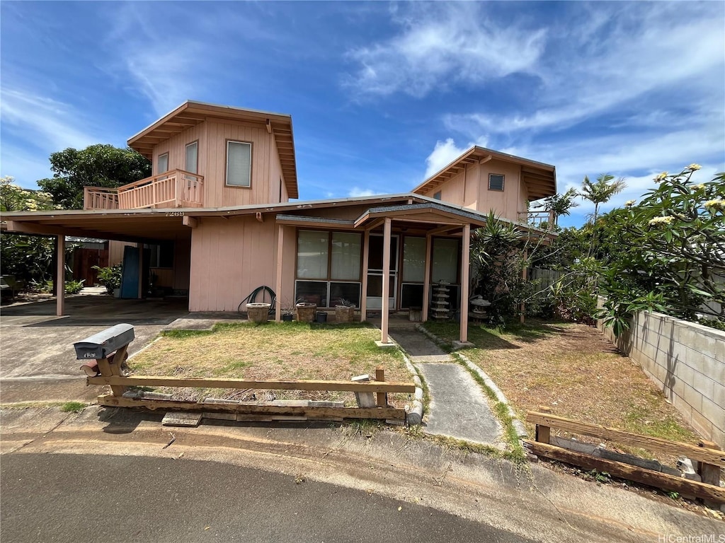7269 Kauhako St, Honolulu, HI 96825 - view of front of house featuring a balcony, fence private yard, and a front lawn