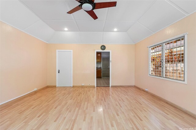spare room with ceiling fan, wood finished floors, lofted ceiling, baseboards, and recessed lighting