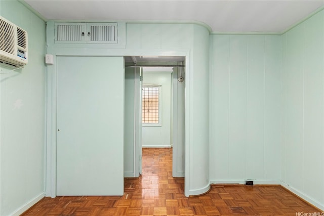 unfurnished bedroom featuring a wall mounted AC