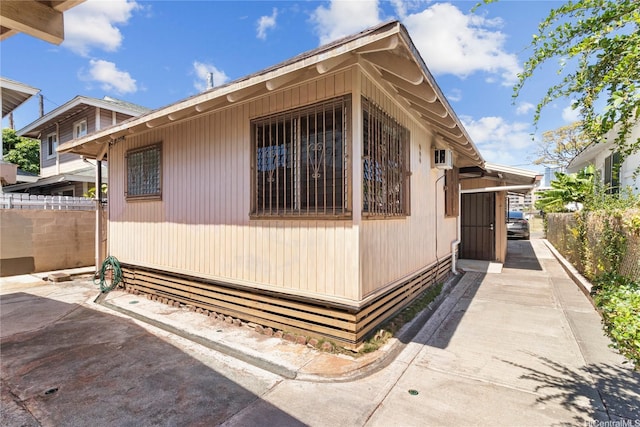 view of home's exterior featuring fence