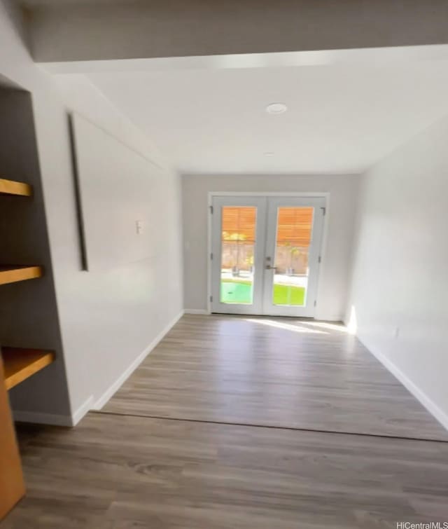 362 Waiopua Pl, Honolulu, HI 96825 - empty room featuring french doors, wood finished floors, and baseboards