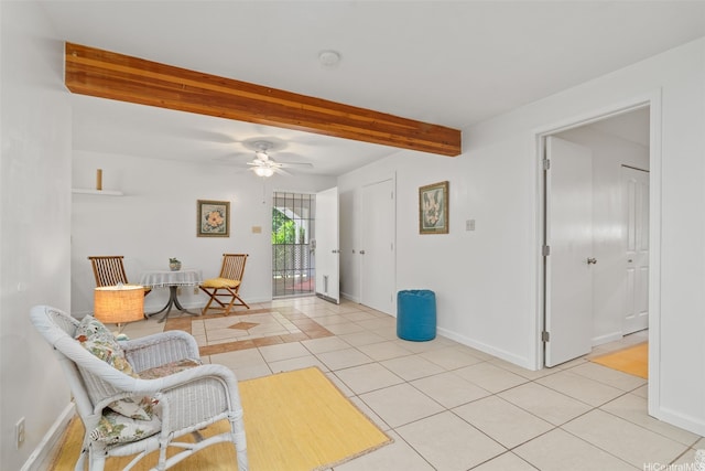 2107 Makanani Dr, Honolulu, HI 96817 - living area with light tile patterned floors, baseboards, a ceiling fan, and beam ceiling