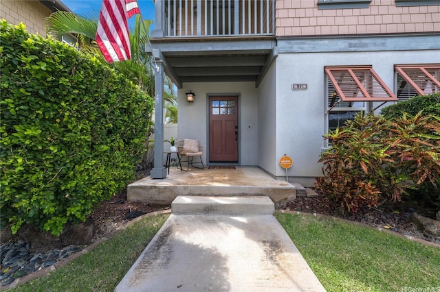 91-1180 Waiemi St, Ewa Beach, HI 96706 - property entrance featuring a balcony and stucco siding