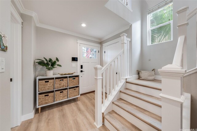 91-1180 Waiemi St, Ewa Beach, HI 96706 - entryway featuring healthy amount of natural light, stairway, ornamental molding, light wood-style flooring, and recessed lighting