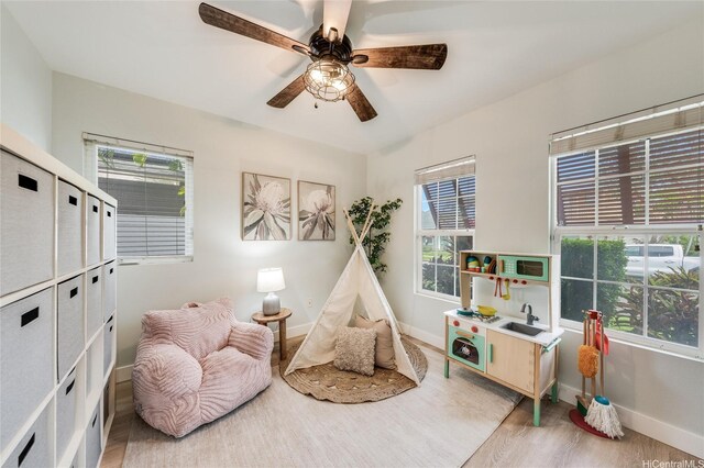 91-1180 Waiemi St, Ewa Beach, HI 96706 - living area with baseboards, healthy amount of natural light, and light wood finished floors
