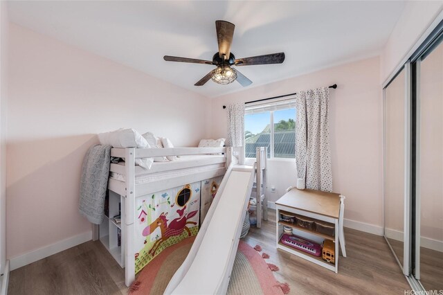 91-1180 Waiemi St, Ewa Beach, HI 96706 - bedroom featuring wood finished floors, baseboards, a closet, and ceiling fan